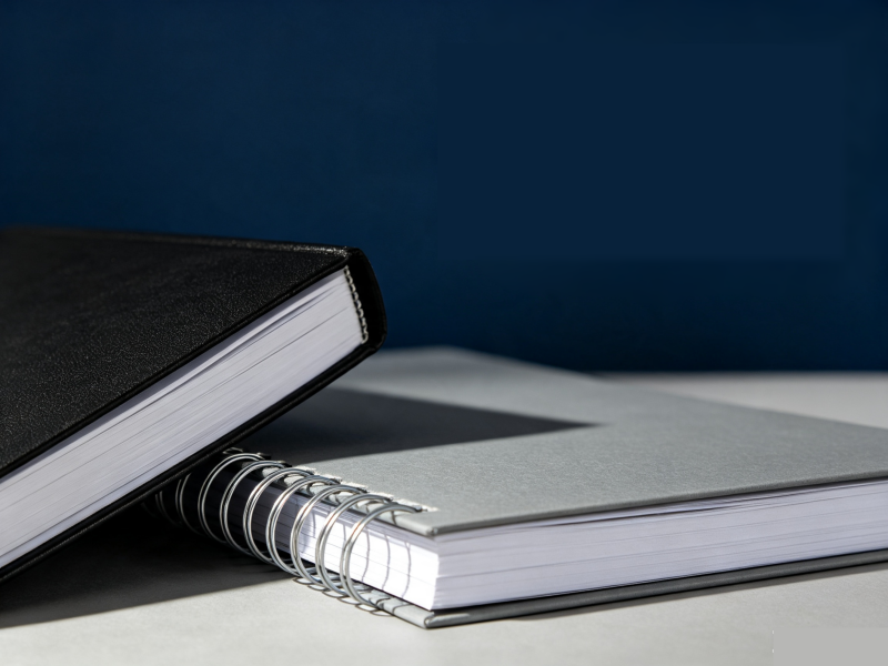 composition book and spiral notebook